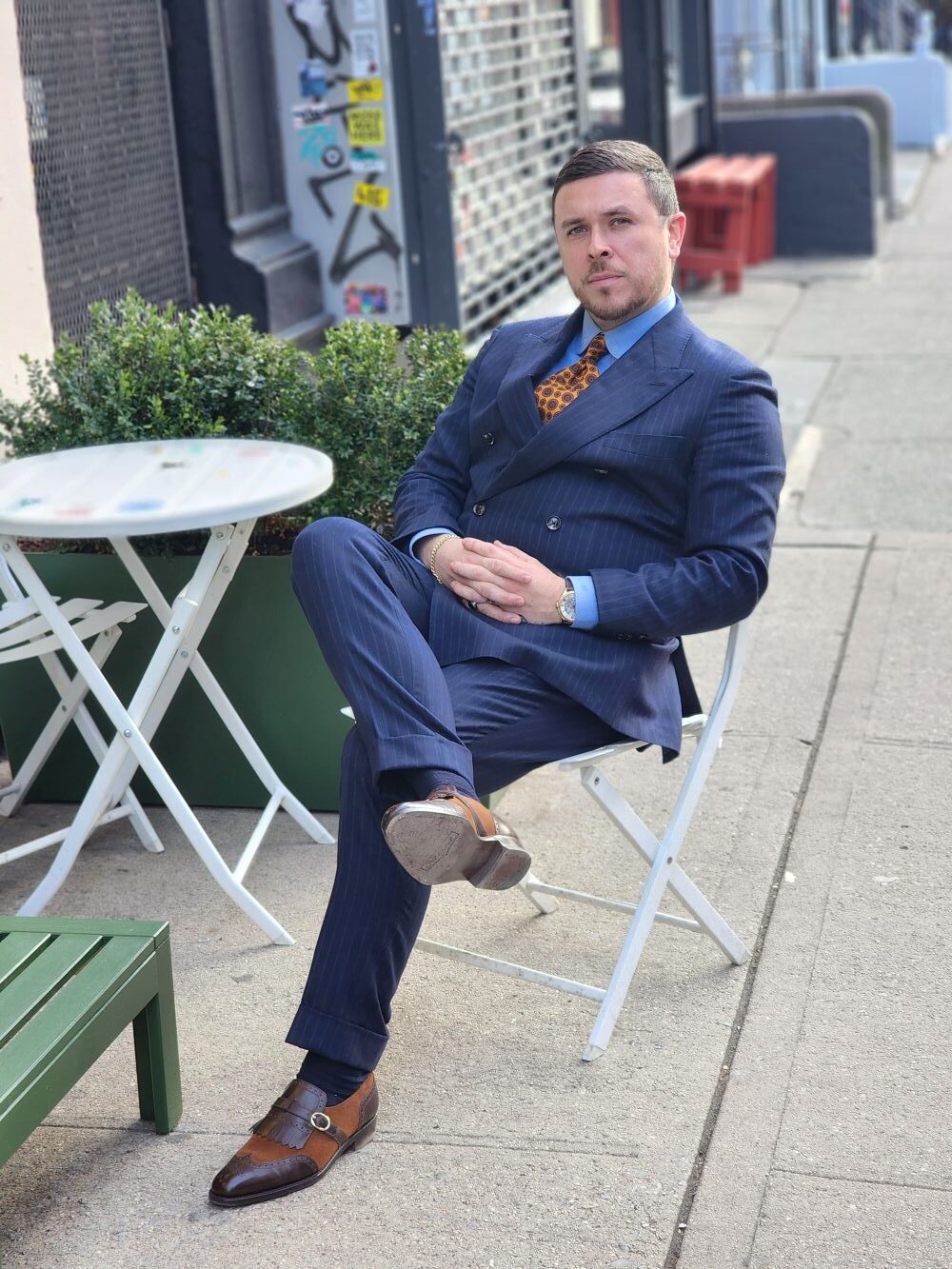 brown shoes with a navy suit