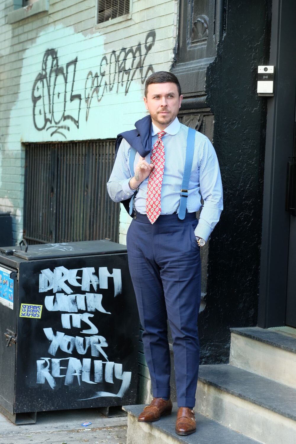 brown shoes with a navy suit