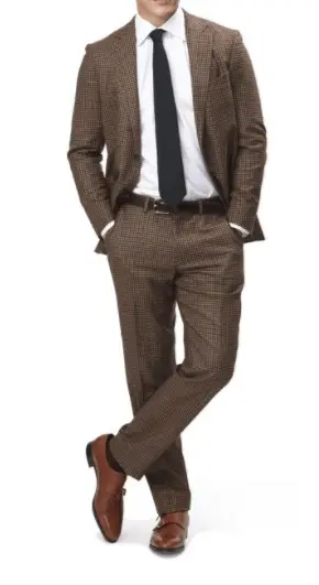 an example of a healthy and subtle complementing contrast. Slightly different colors but belt ties in well with trousers/suit -- courtesy of The Wall Street Journal